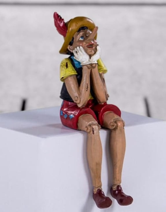Antiqued Sitting Pinocchio Decorative Figure